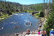 Kids swim in the Firehole River